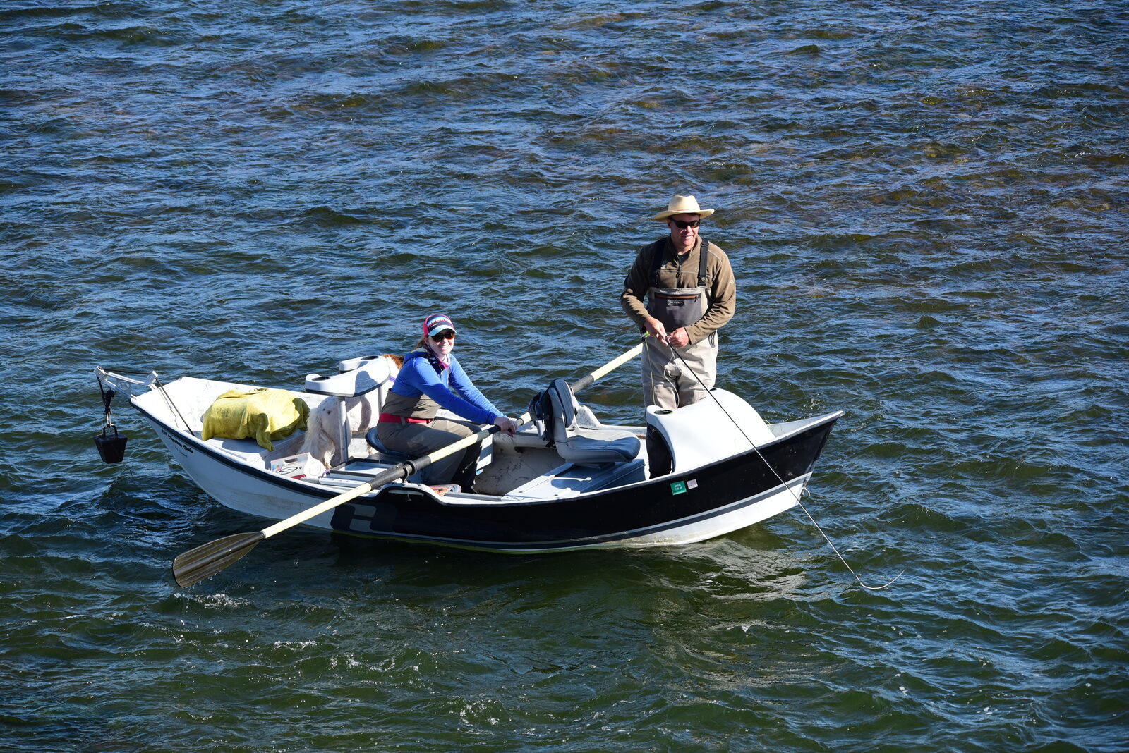Two anglers fishing tailwater from a drift boat